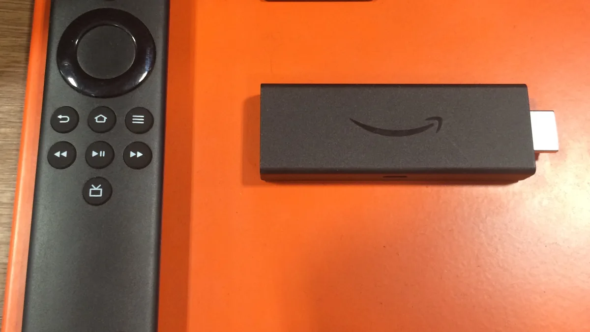 Photo by TaurusEmerald, licensed under CC BY-SA 4.0 (Wikimedia Commons) Amazon Fire TV Stick and remote control, representing IPTV app crashes, login, and playlist troubleshooting